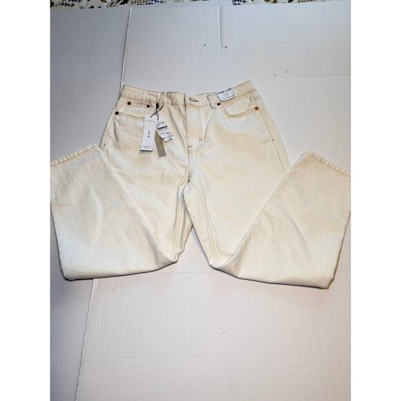 Topshop Denim - Topshop Mom jeans in white denim with a high-rise fit.